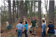 Volunteers stand and talk before starting work.