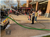 Little Girl Gets to Try out Fire Hose at a Fire Department Community Day