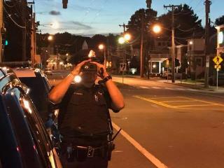 Officer Coming Up to Pulled Over Vehicle